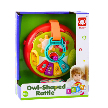 Ambalaj pentru bufnița interactivă Owl-Shaped Rattle, cu produsul vizibil în cutie.