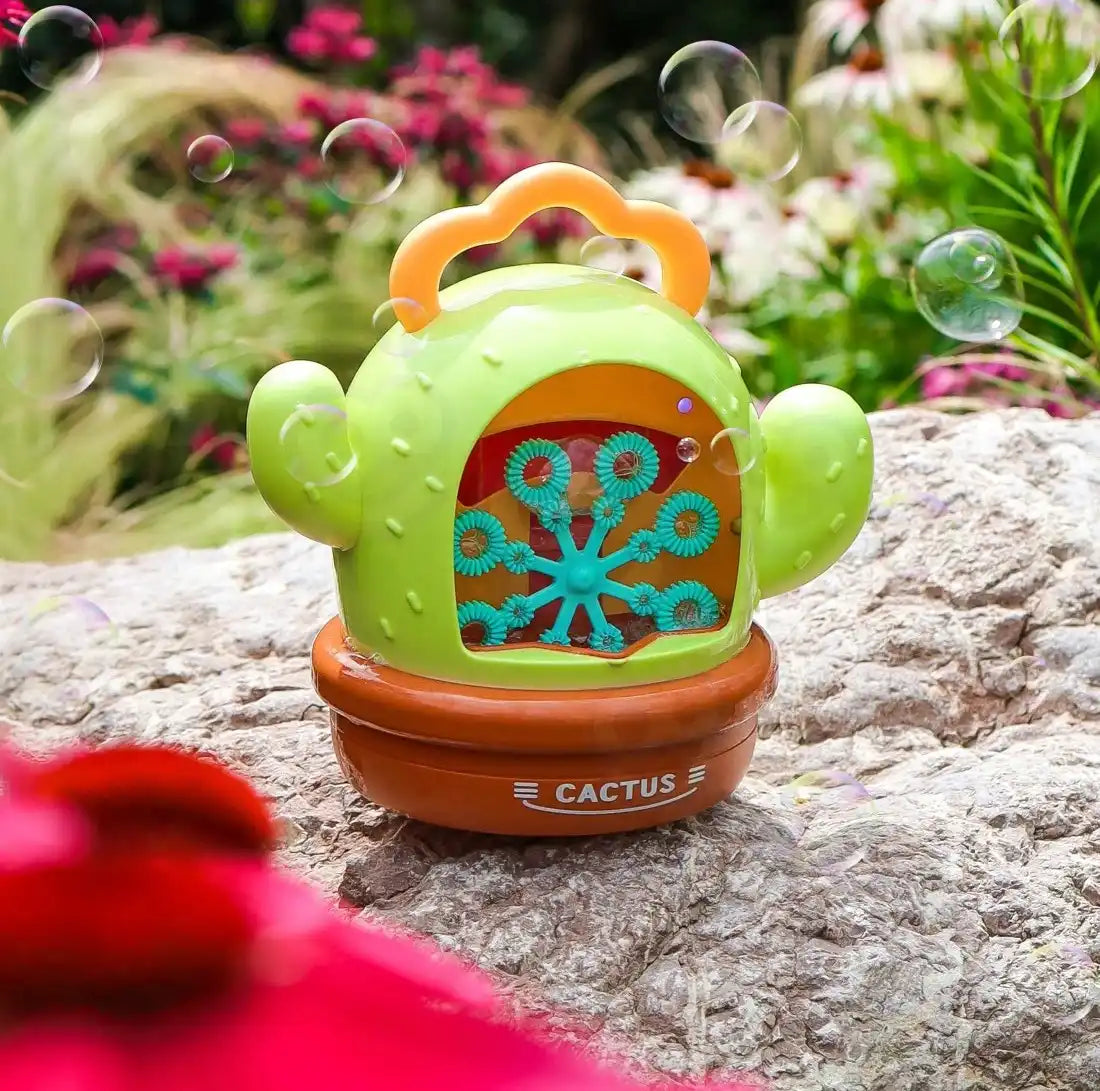 Aparat baloane Cactus Bubble Woopie pe stâncă, cu rotiță pentru bule și mâner galben.