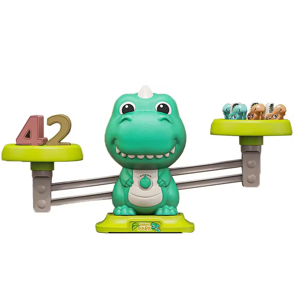 Balanță Woopie în formă de dinozaur cu numărul 42 și figurine pe taler.
