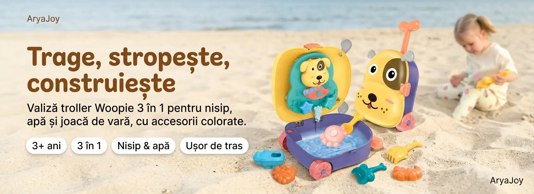 Copil care se joacă pe plajă cu setul Woopie pentru nisip și apă, lângă valiza Cățeluș.