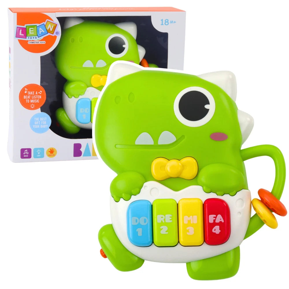 Mini pian Lean Toys dinozaur verde cu ambalaj, clape colorate, lumini și sunete pentru copii 18+ luni