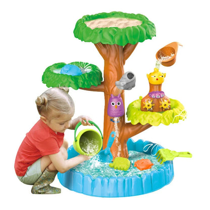 Masa Woopie Big Tree Water Table cu copil, copac cu apă, bazin albastru, accesorii și ambalaj.