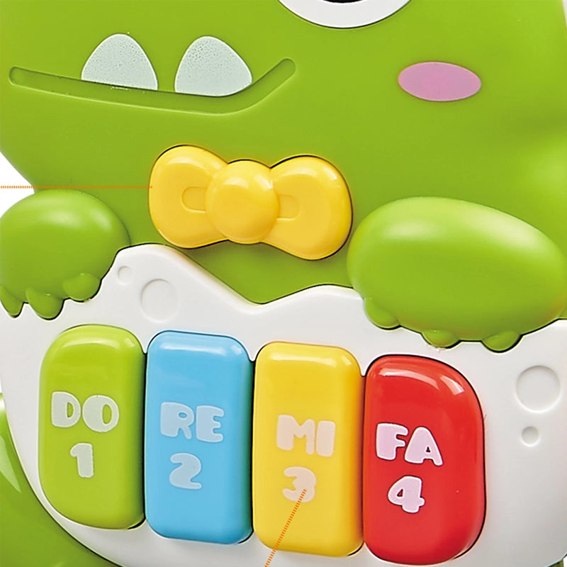 Close-up cu clapele DO RE MI FA ale mini pianului dinozaur Lean Toys, în culori vii.