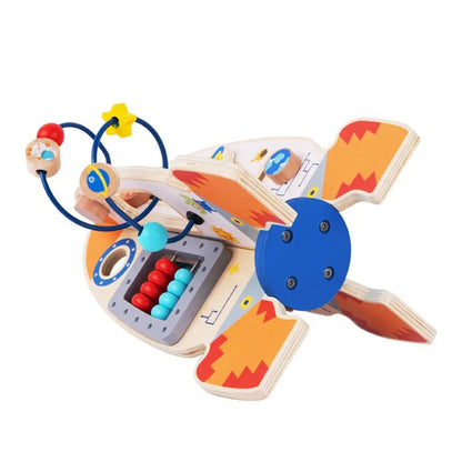 Racheta educativa Tooky Toy vazuta de sus, cu abac si bile pe trasee metalice.