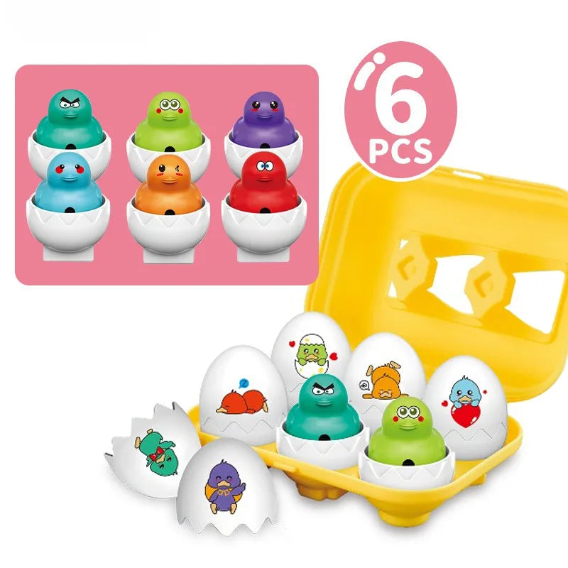 Set Woopie cu 6 ouă cu puișori, coji albe decorate și cutie galbenă pentru depozitare.